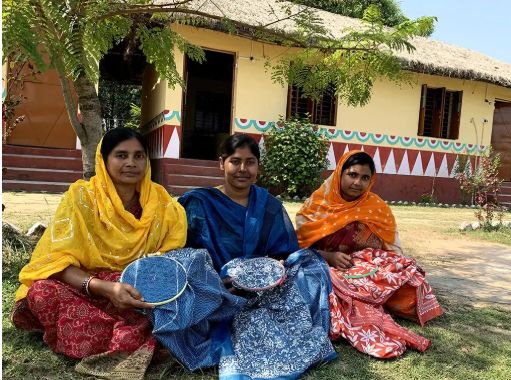 Artisan embroidering kantha by hand